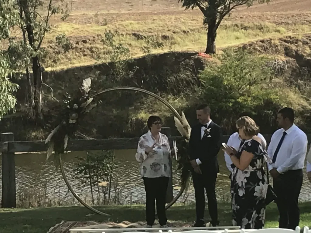 Outdoor wedding ceremony by a river.